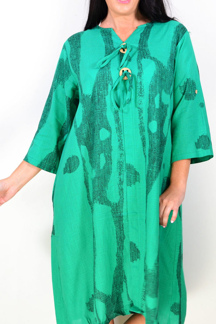 Green linen blend tunic dress by Ruby Rain, featuring a relaxed fit with long sleeves and a comfortable, breathable fabric.