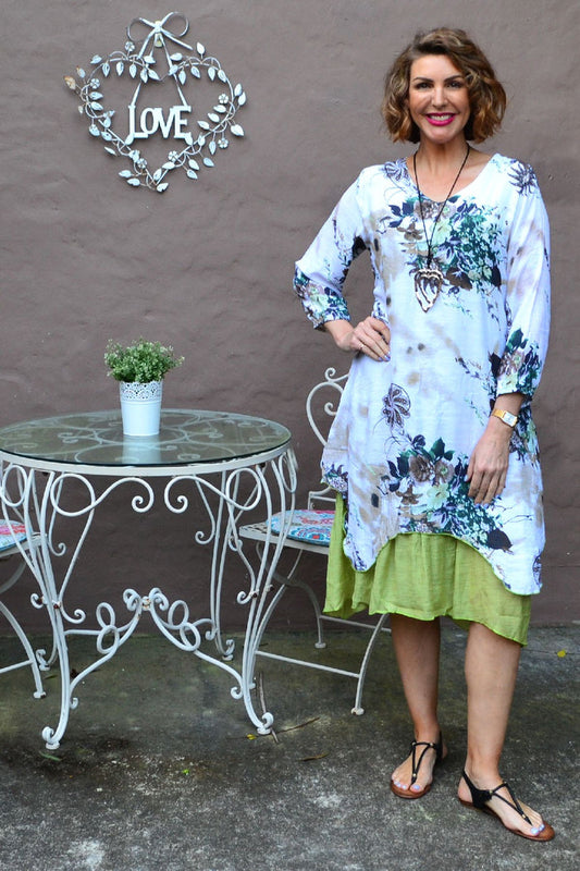 Close-up of a green paisley layered tunic dress from I Love Tunics, showcasing intricate paisley patterns and flowing fabric.