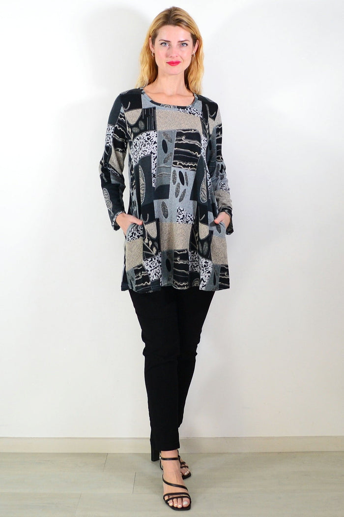 Grey abstract print fleece tunic top by Hourglass, showcasing a cozy, stylish long sleeve tunic with artistic pattern.