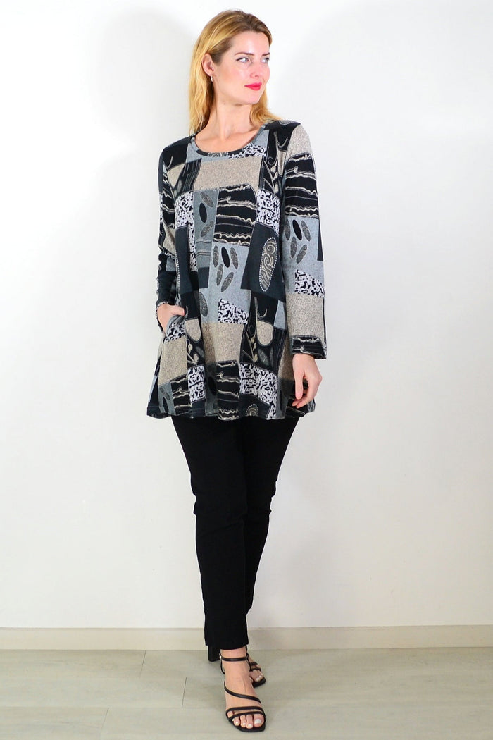 Grey abstract print fleece tunic top by Hourglass, showcasing a cozy, stylish long sleeve tunic with abstract patterns.