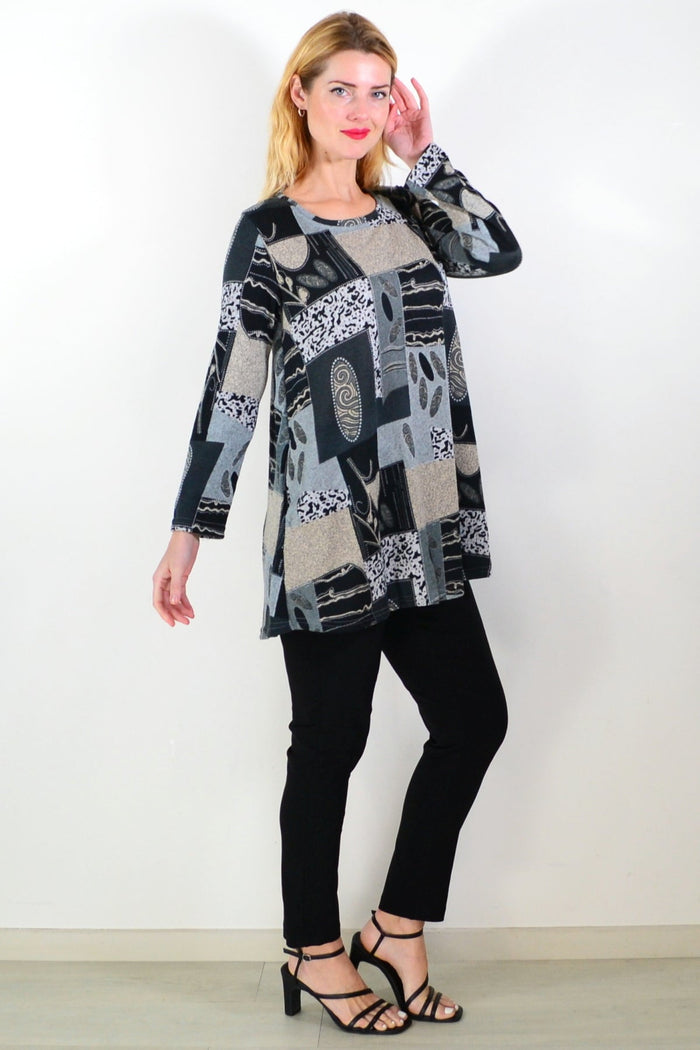 Grey abstract print fleece tunic top from Hourglass, showcasing a cozy, stylish design with a relaxed fit and artistic pattern.