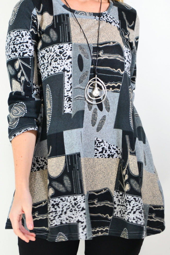 Grey abstract print fleece tunic top by Hourglass, showing a cozy, relaxed fit with a modern artistic pattern.