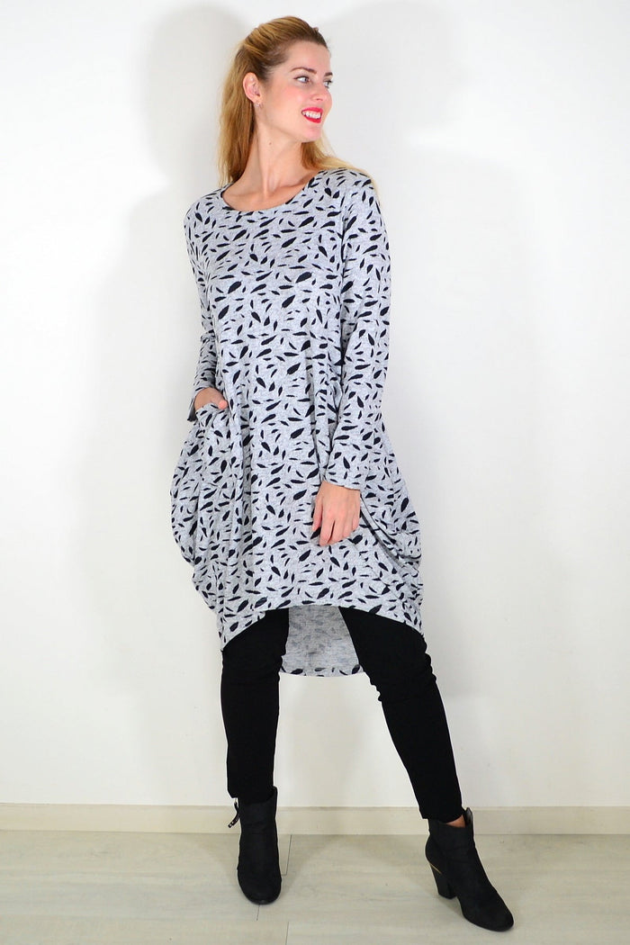 Grey floating leaf knit tunic top by I Love Tunics, featuring a relaxed fit and subtle leaf pattern, displayed on a hanger.