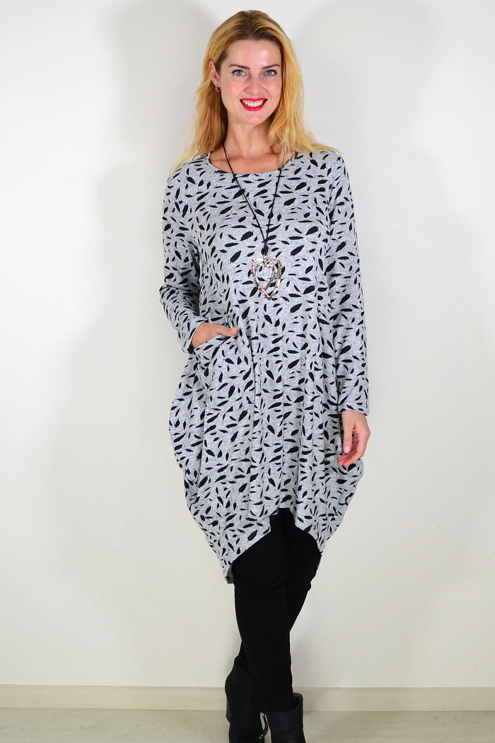 Grey floating leaf knit tunic top by I Love Tunics, featuring a relaxed fit and leaf pattern, displayed on a hanger.