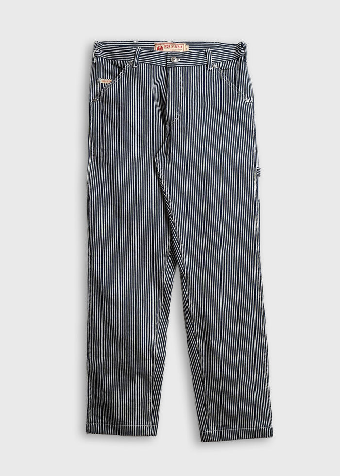 Blue and white striped pants with a button closure, featuring a label at the waistband, displayed on a plain white background.