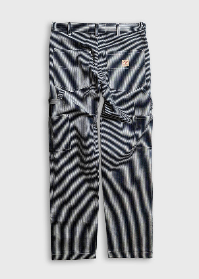 Blue and white striped work pants with multiple pockets and a logo patch on the back pocket, laid flat on a white background.