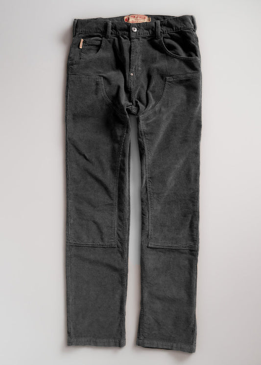 Dark gray corduroy pants with front pockets and button closure, laid flat on a light background.