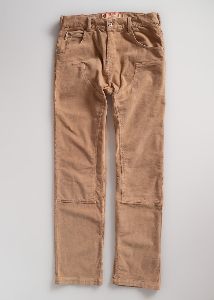 Brown corduroy pants with front pockets and belt loops, laid flat on a white background. Iron & Resin label visible inside.