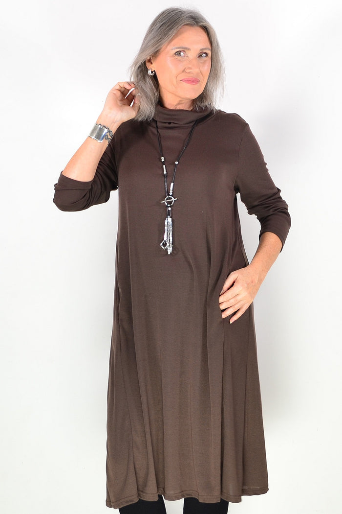 Long brown roll neck tunic from Hourglass Avalon, featuring a cozy fit and soft fabric, displayed on a hanger.