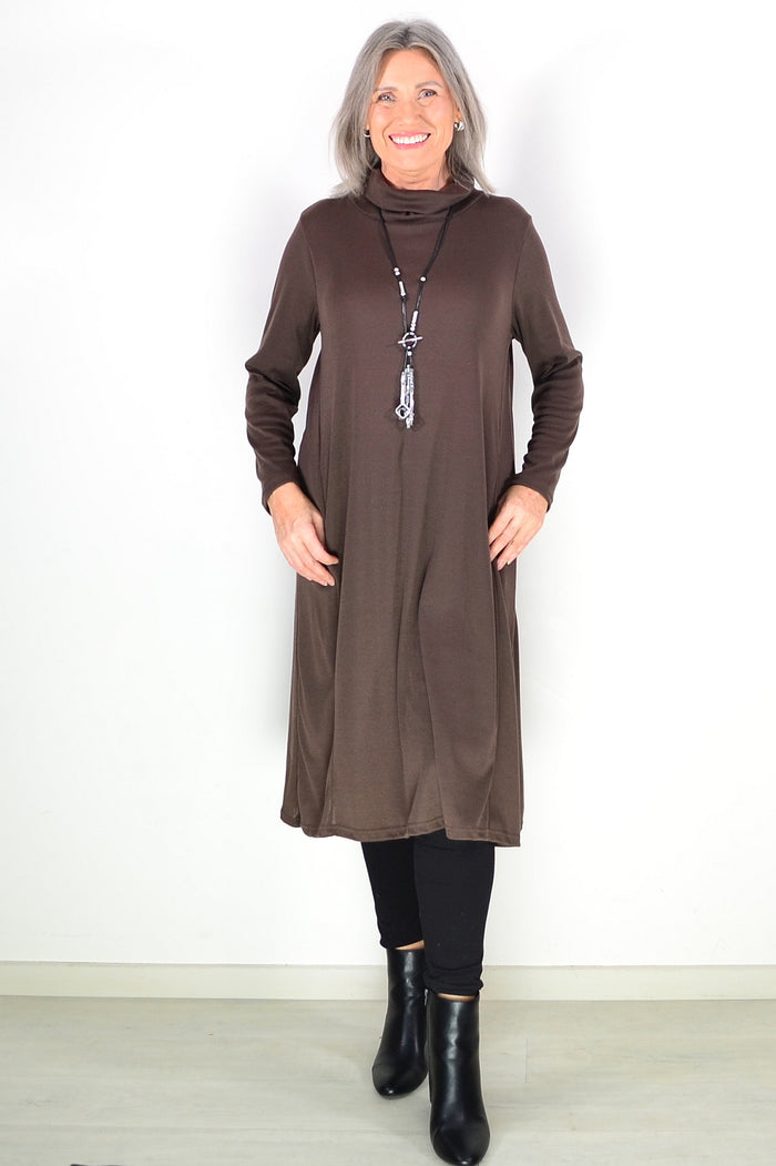 Long brown hourglass Avalon tunic with roll neck and relaxed fit, styled with long sleeves and a casual, comfortable look.