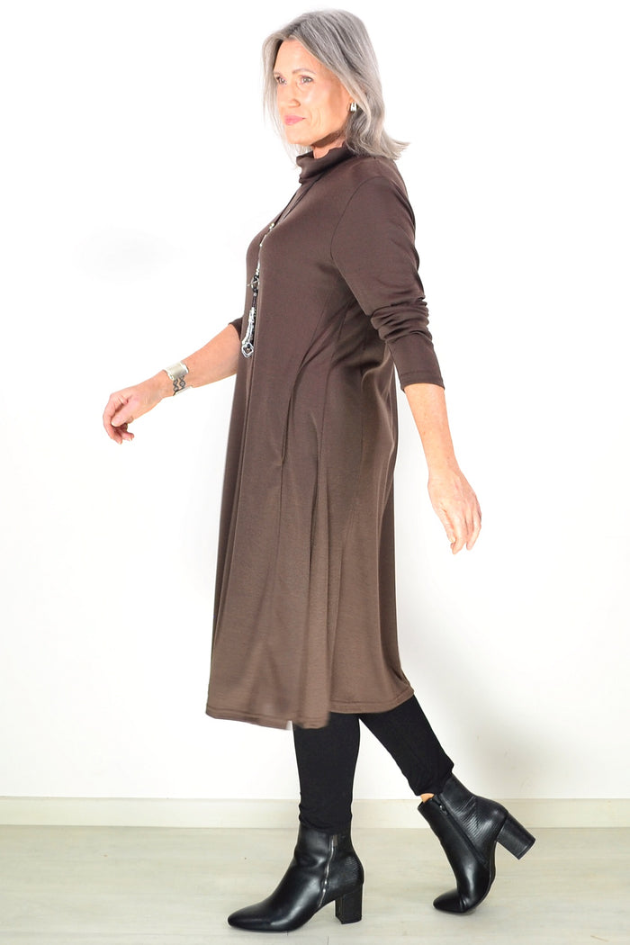 Long brown roll neck tunic by Hourglass Avalon, featuring a cozy fit and ribbed collar, styled on a mannequin.