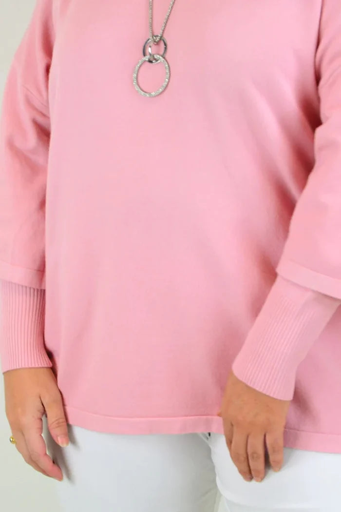 Pink Lush Debs double sleeve tunic jumper by Cali&Co, featuring a stylish relaxed fit and double sleeve design, displayed on a hanger.