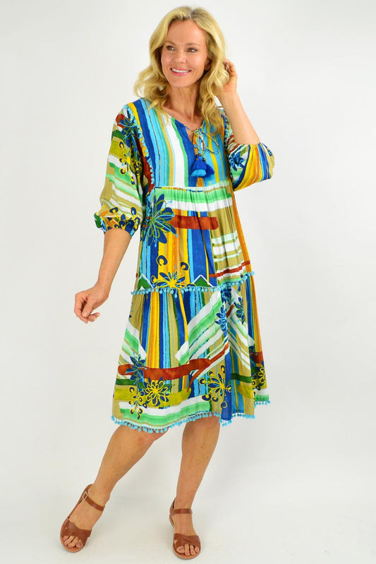 Orientique Malaga Midi Boho Tunic Dress with floral patterns, flowing fabric, and bohemian style, worn as a casual summer dress.