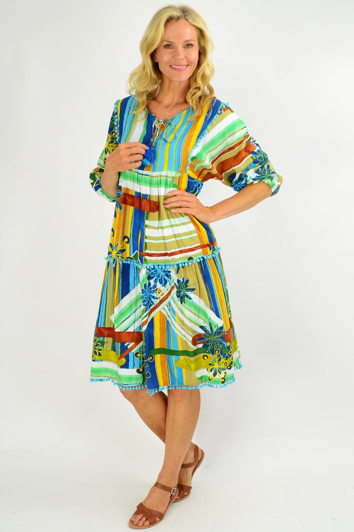 Orientique Malaga Midi Boho Tunic Dress displayed on a hanger with flowing fabric and bohemian print, perfect for casual summer wear.