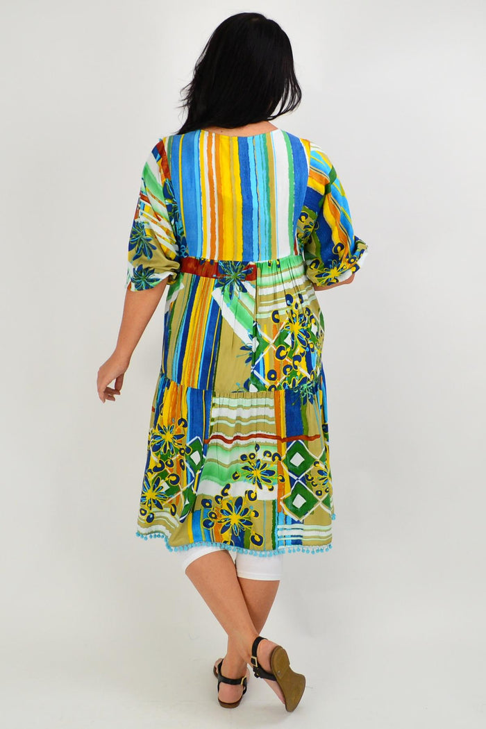 Orientique Malaga Midi Boho Tunic Dress shown with flowing fabric and intricate patterns in a relaxed, bohemian style.