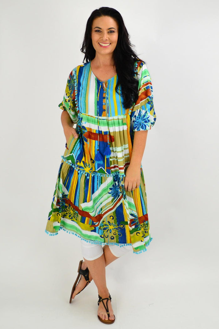 Orientique Malaga Midi Boho Tunic Dress, lightweight fabric with vibrant bohemian print, styled on a hanger.