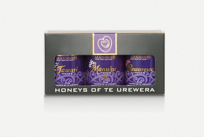 Three pots of honey in purple packaging