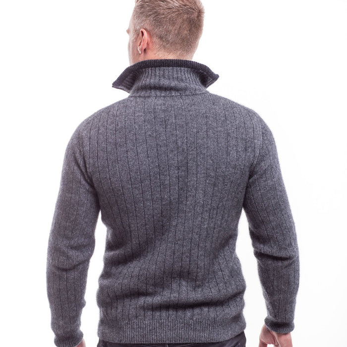 Back view. Male model wearing cable jersey. Grey and black.