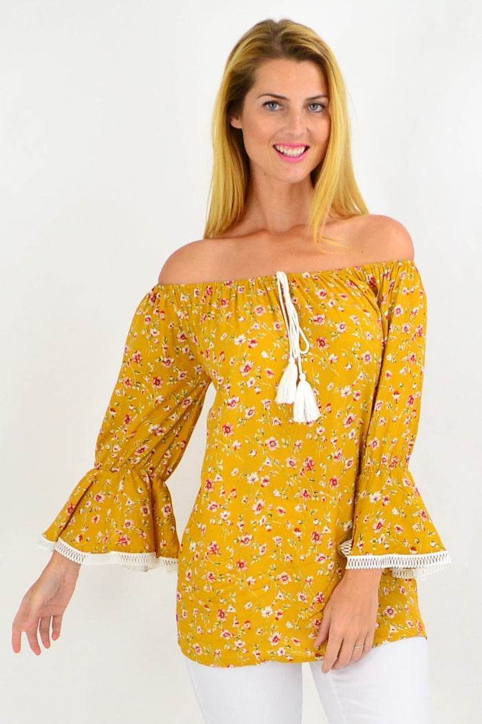 Mustard floral tassel off-shoulder boho tunic top by Missy Q with rayon fabric and flowy design.