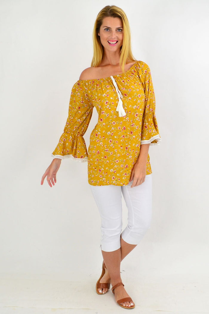 Mustard floral tassel off-shoulder boho rayon tunic top from Missy Q with floral pattern and tassel details.