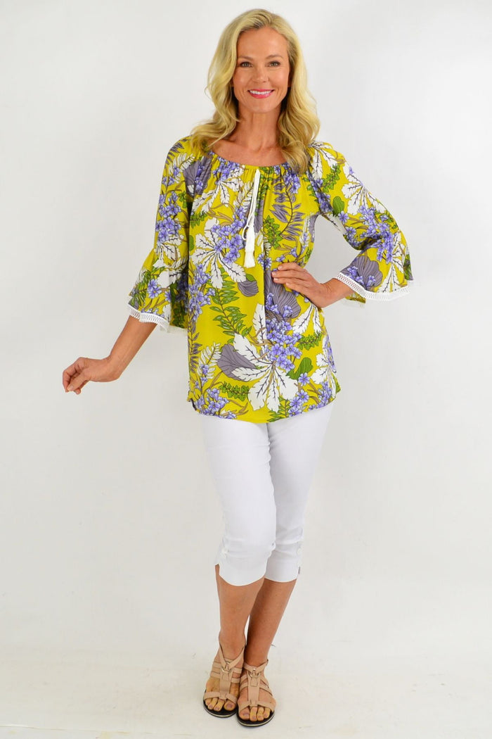 Mustard tropical floral off-shoulder tassel tunic top by Missy Q, featuring vibrant summer print and relaxed fit.