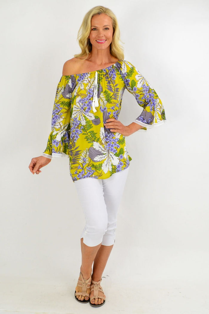 Mustard tropical floral off-shoulder tassel tunic top by Missy Q, featuring vibrant summer print and flowing fabric.