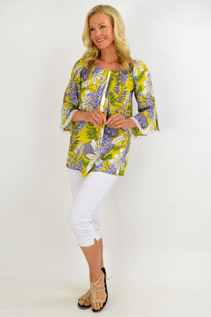 Mustard tropical floral tassel off-shoulder tunic top by Missy Q, featuring vibrant summer floral print and tassel details.