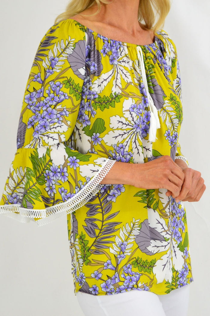 Mustard tropical floral off-shoulder tassel tunic top by Missy Q, featuring vibrant summer design and relaxed fit.