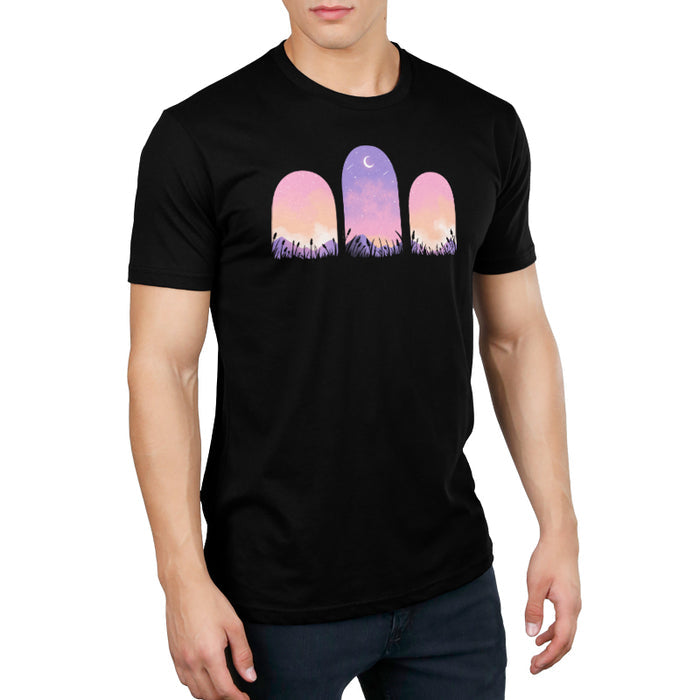 Premium Cotton T-shirt_TeeTurtle Mystic Triptych black t-shirt featuring three arched windows showing a purple and pink sky with a crescent moon and stars, silhouetted grass, and mountains in the foreground.