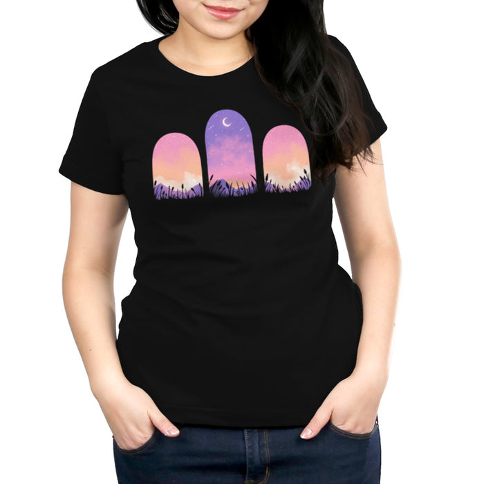 Premium Cotton T-shirt_TeeTurtle Mystic Triptych black t-shirt featuring three arched windows showing a purple and pink sky with a crescent moon and stars, silhouetted grass, and mountains in the foreground.