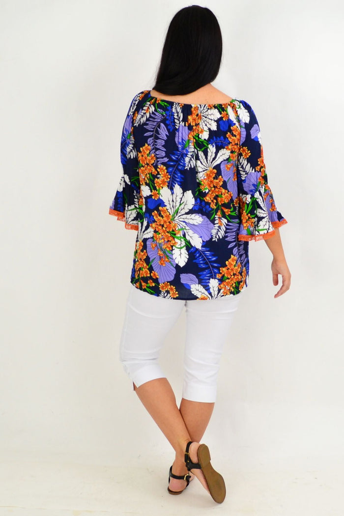 Navy and orange tropical off-shoulder tunic top by Missy Q with colorful floral patterns and relaxed fit.