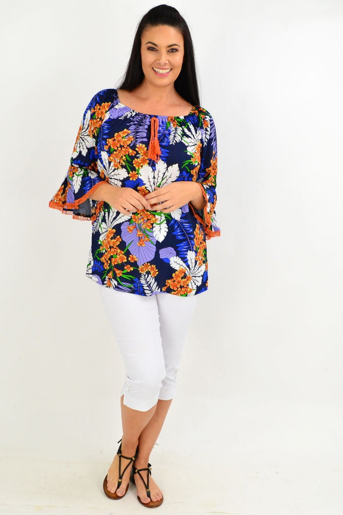 Navy and orange tropical off-shoulder tunic top by Missy Q featuring vibrant floral patterns and a relaxed fit.