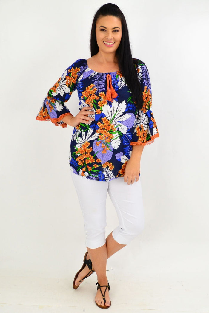 Navy and orange tropical off-shoulder tunic top by Missy Q featuring vibrant floral patterns and lightweight fabric.
