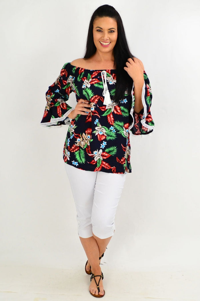 Navy tropical tassel off-shoulder tunic top by Missy Q featuring boho floral rayon fabric and tassel details.