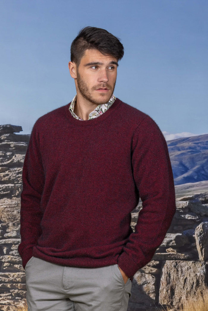 Man wearing the Noble Wilde - Merino & Possum Cambridge Crew Sweater (NW1001) in the colour Port.