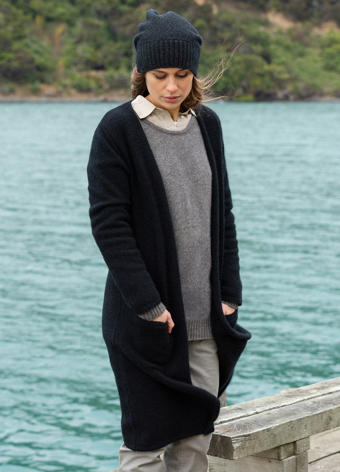 Woman wearing Noble Wilde - Merino & Possum Longline Coat in the colour Black