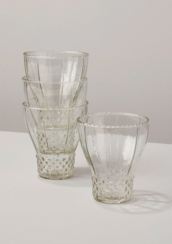 Glasses in bell shape with hobnail pattern.