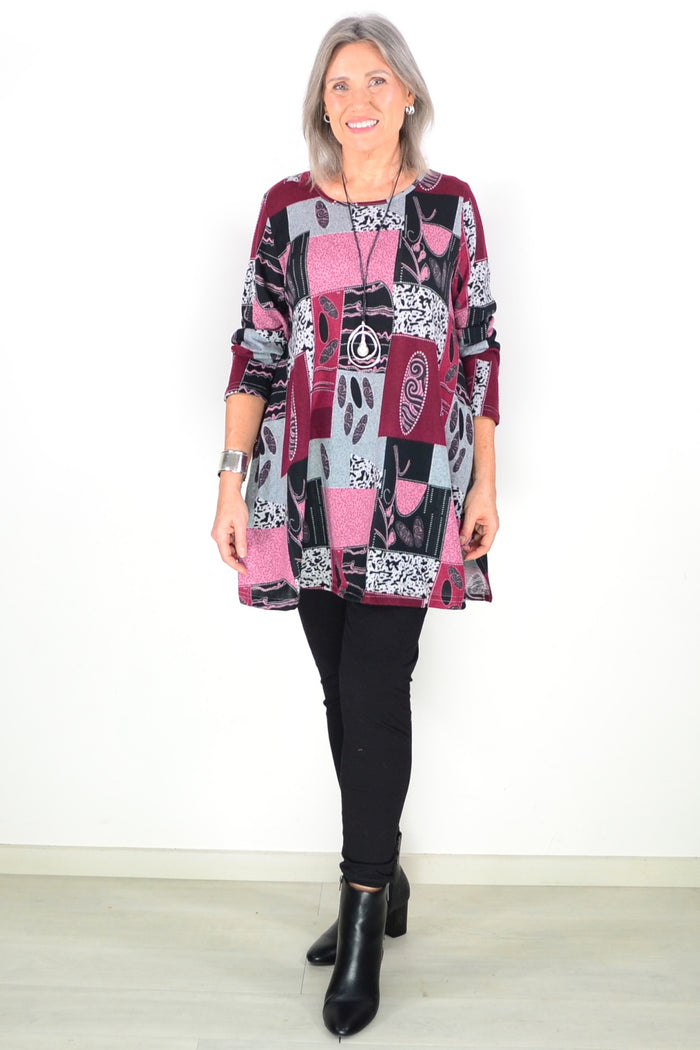 Pink abstract print fleece tunic top by Hourglass, featuring a cozy, stylish design with vibrant pattern and relaxed fit.