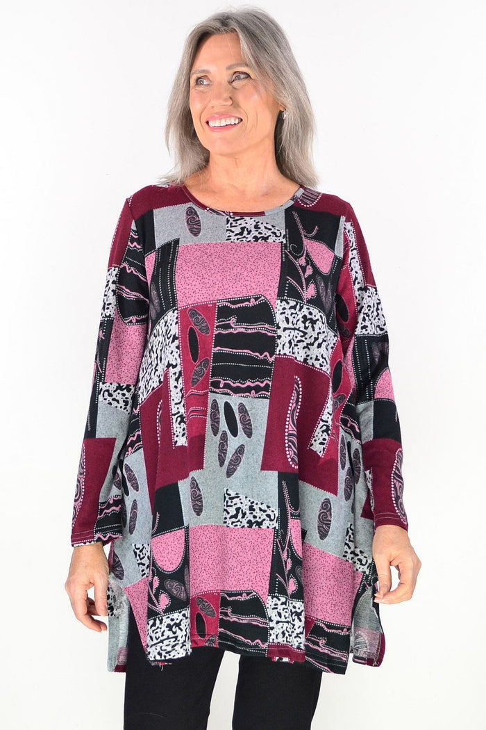 Pink abstract print fleece tunic top by Hourglass, soft and cozy with a vibrant, artistic design visible in the image.