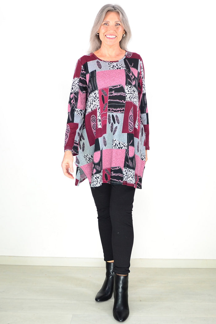 Pink abstract print fleece tunic top by Hourglass, featuring a cozy, stylish design with vibrant patterns and a relaxed fit.