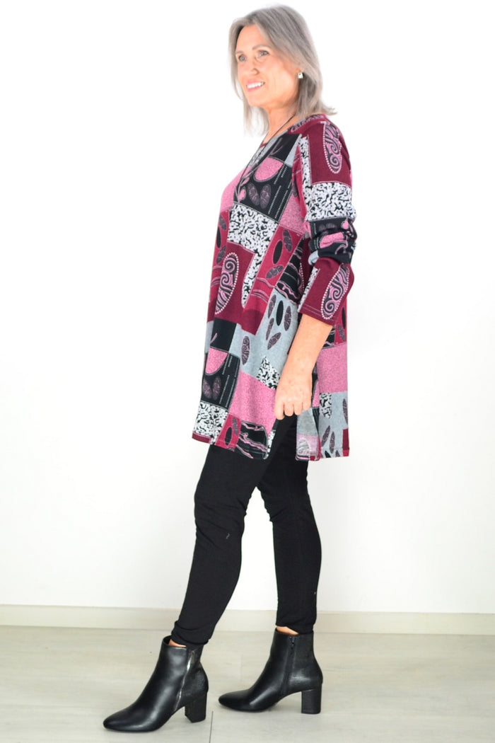 Pink abstract print fleece tunic top by Hourglass, featuring a cozy, stylish design with a relaxed fit and vibrant pattern.