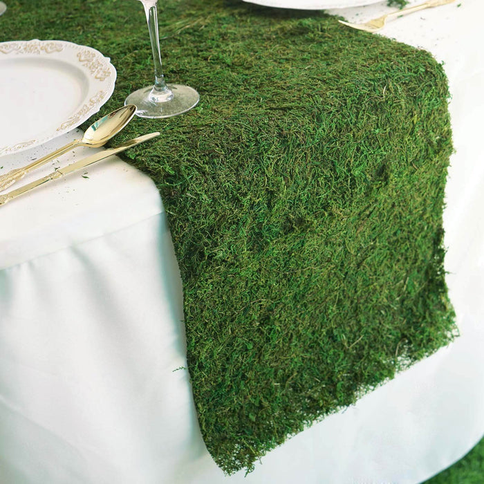 Green moss table runner for elegant dining decor.