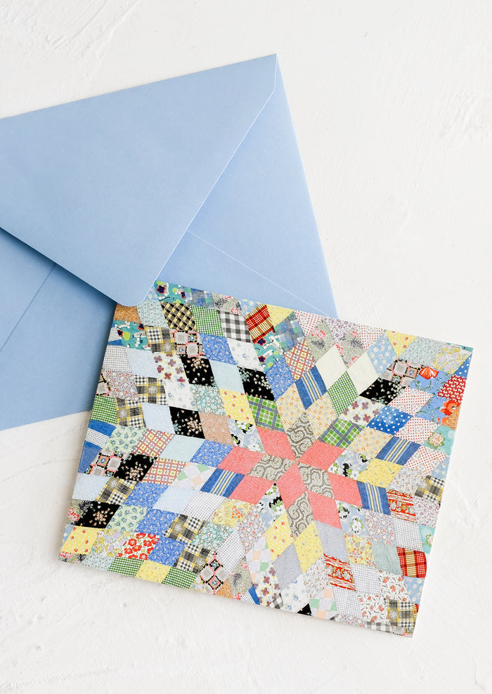 A card and envelope with quilt pattern.