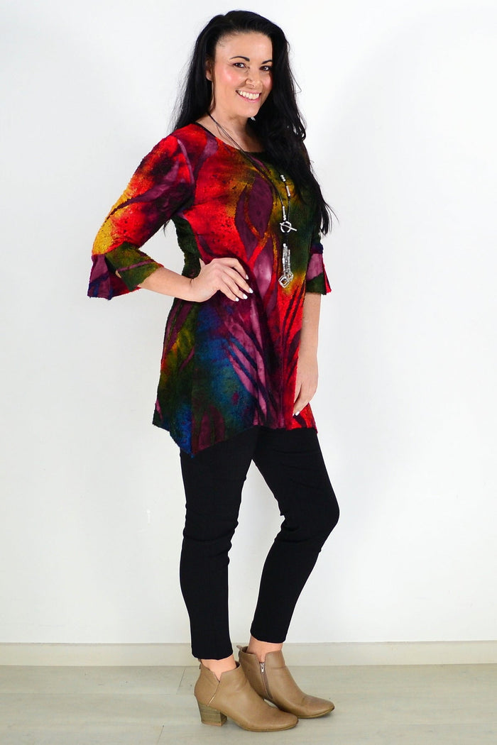 Colorful red forest pattern ladies tunic top by Whispers, showcasing vibrant fabric and relaxed fit on model.