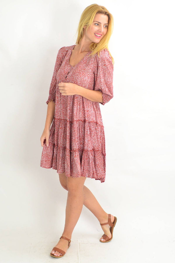 Rust smocking sleeve tiered tunic dress by Silver Wishes, featuring long sleeves, tiered design, and relaxed fit.