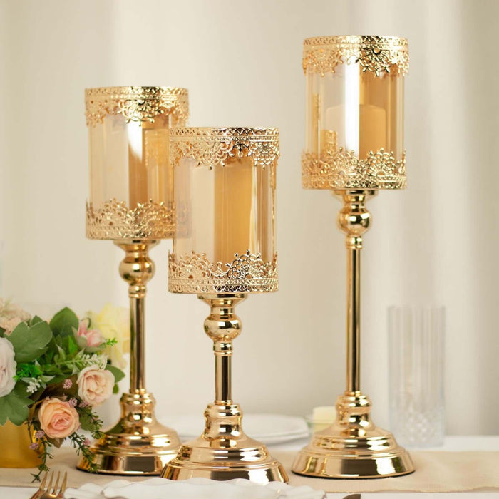 Elegant gold candle holders with decorative detailing, perfect for table decor.