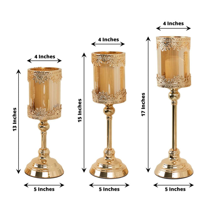 Set of three elegant gold candle holders with measurements displayed.