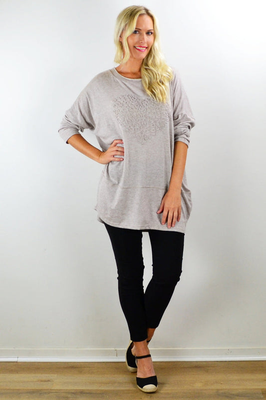 Taupe straight-knit tunic top by Indigo Designs, displayed on a hanger, featuring a relaxed fit and soft fabric for casual wear.