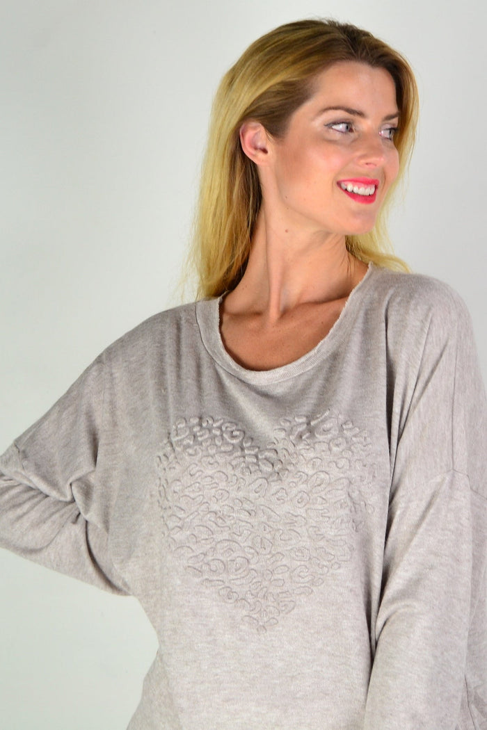 Taupe straight-knit tunic top by Indigo Designs, featuring a cozy fit and simple design, displayed on a hanger.
