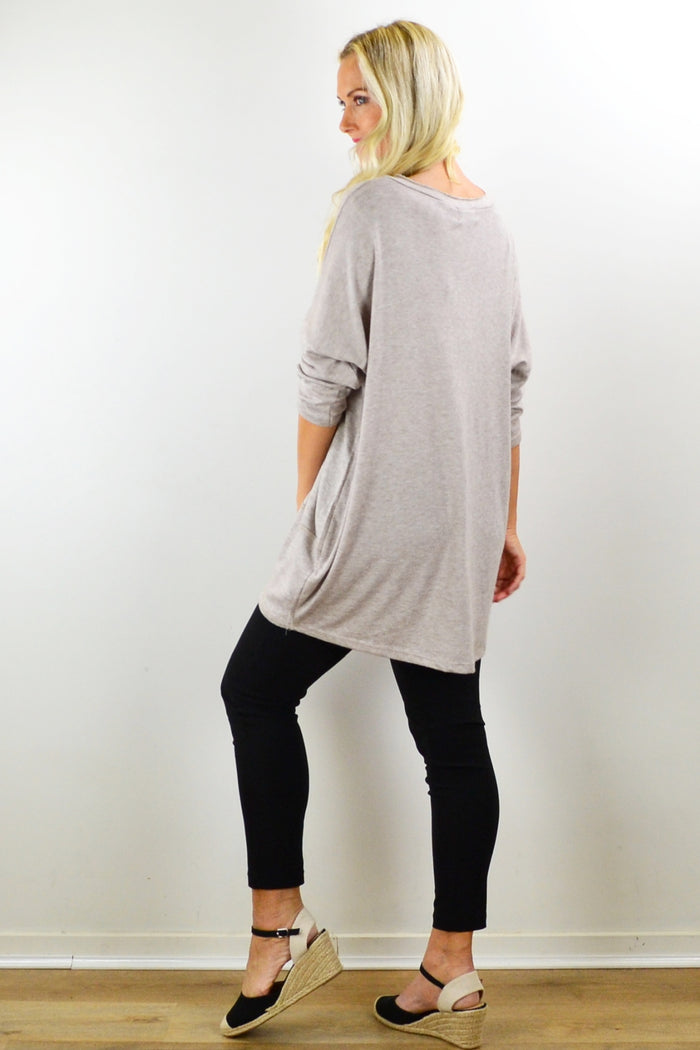 Taupe straight-knit tunic top by Indigo Designs, featuring a relaxed fit and subtle texture, displayed on a hanger.